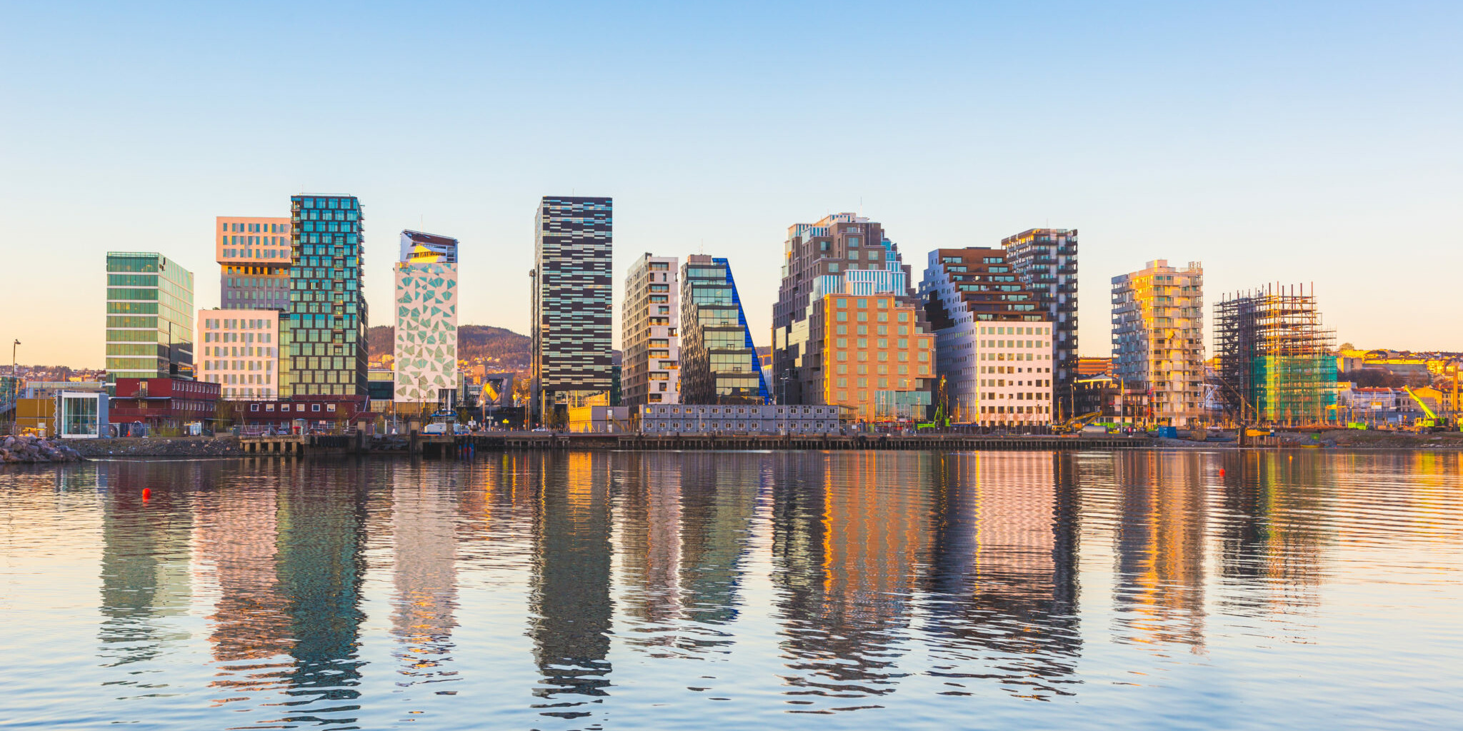 Modern buildings in Oslo with their reflection into the water