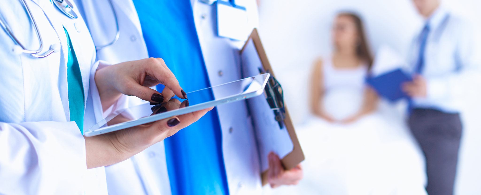 Young woman doctor holding a tablet pc