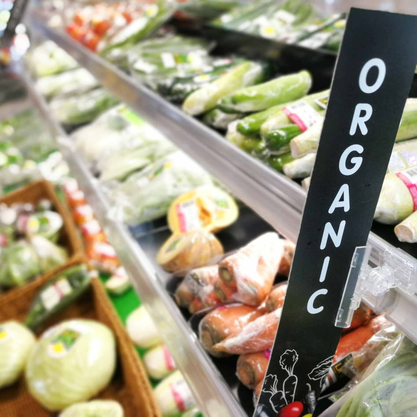 Organic signage at vegetable and fruits produce section of supermarket