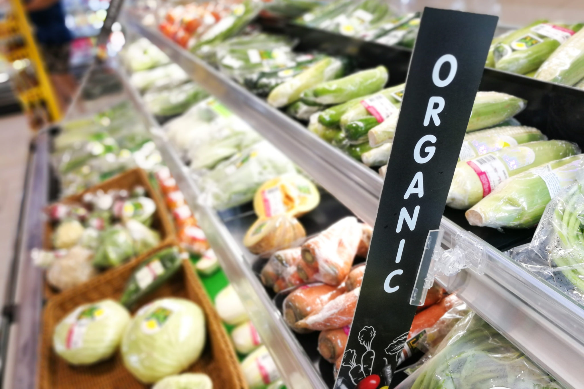 Organic signage at vegetable and fruits produce section of supermarket